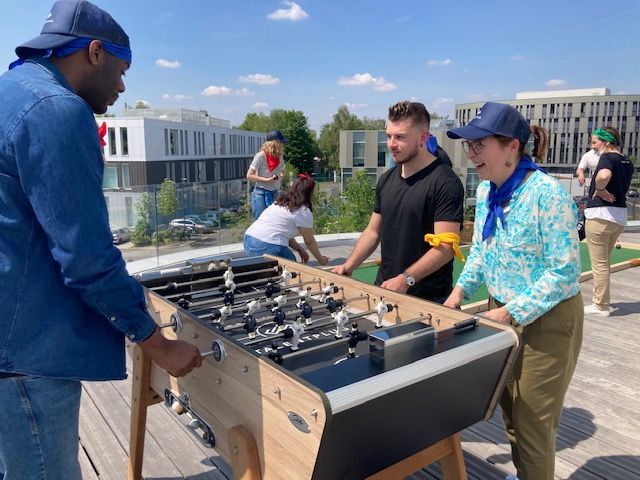 Team talentplug playing foosball