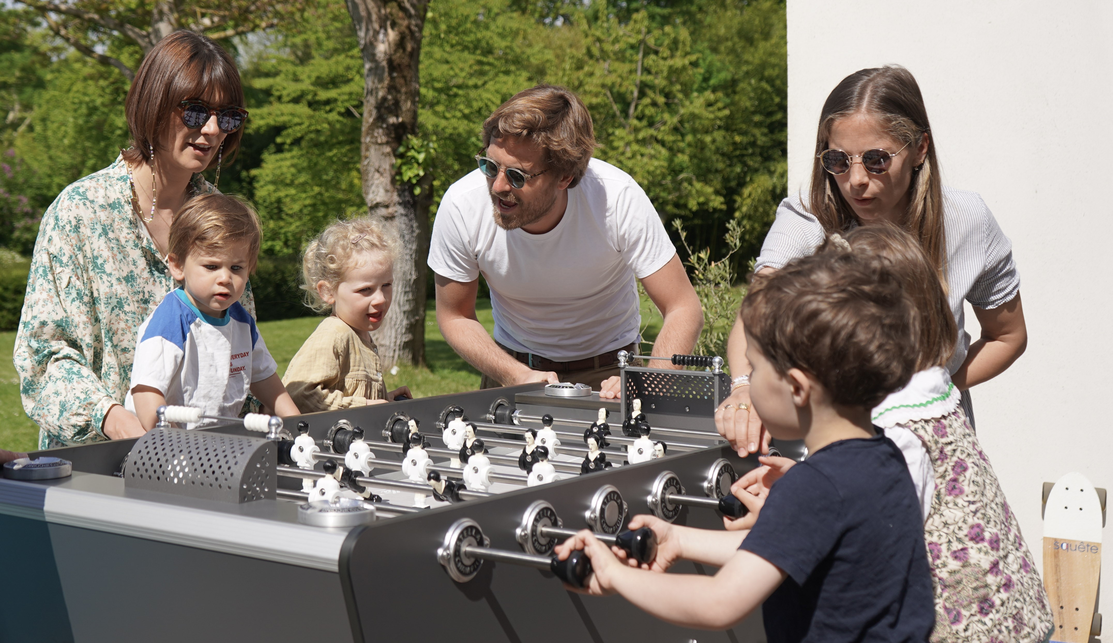 Family playing table soccer